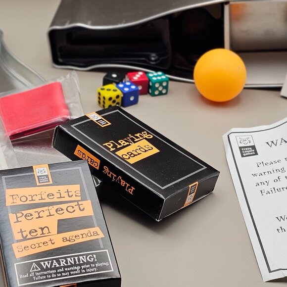 Utterly Outrageous Drinking Games bottle shaped tin box with 25 games dated 2007 - Picture 6 of 14